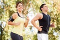 Couple running and listening to music Royalty Free Stock Photo