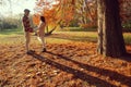 Couple`s autumn walk through the park Royalty Free Stock Photo