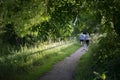 Couple with the same color clothes on their back walking on Grantham Canal,UK.