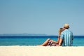 Couple on the sand by the sea Royalty Free Stock Photo