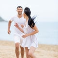 Couple on sand seashore in cloudy day Royalty Free Stock Photo