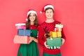 Couple in santa hats with gifts Royalty Free Stock Photo