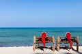 Couple in Santa hats on tropical beach Royalty Free Stock Photo