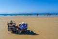 Couple sat in deckchairs on the beach Royalty Free Stock Photo