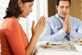 Couple Saying Grace Before Meal At Home Royalty Free Stock Photo