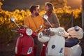 Couple on scooter enjoying in romantic road trip