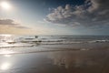 Couple in sea water against sunlight