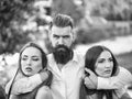 Couple secrets fantasy. Bearded man and two women outdoor Royalty Free Stock Photo