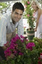 Couple Selecting flowers at plant nursery portrait Royalty Free Stock Photo