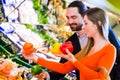 Couple selecting vegetables in hypermarket