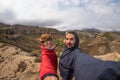 Couple selfie with outstretched arms, wind mountain summit, Golden Gate Highlands National Park, South Africa. Concept of adventur Royalty Free Stock Photo