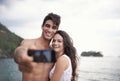 Couple, selfie and smile in nature, travel and love for honeymoon vacation trip. Happy married man, woman and Royalty Free Stock Photo