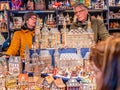 Couple selling traditional Christmas gifts at the Aachen Christmas market, Germany