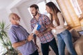 Couple with real-estate agent visiting house for sale