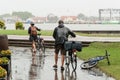 Couple seniors of cyclists in rainy day Royalty Free Stock Photo