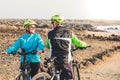 Couple of seniors going to biking at the same hour and bumped and start a conversation - two mature people doing exercise together