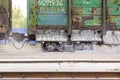 a couple of several rail freight wagons for bulk cargo complete the unloading of rubble that lies along the rail Royalty Free Stock Photo