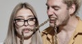 Couple of sexy man and sensual woman. Portrait of sexy coupl. Trendy look. Chains in mouth. Royalty Free Stock Photo