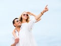 Couple in shades at sea side Royalty Free Stock Photo