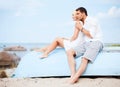 Couple in shades at sea side Royalty Free Stock Photo