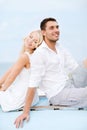 Couple in shades at sea side Royalty Free Stock Photo