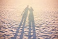 Couple shadow on the beach, sunset lighting, summer vacation concept unusual Royalty Free Stock Photo