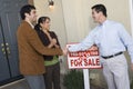 Couple Shaking Hands With Estate Agent Royalty Free Stock Photo