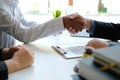 Couple shaking hands to realtor mortgage insurance broker lawyer. customer handshaking with financial advisor for advice