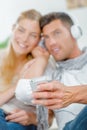 couple sharing headphones Royalty Free Stock Photo