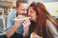 Couple sharing pizza and eating Royalty Free Stock Photo