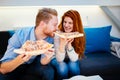 Couple sharing pizza and eating Royalty Free Stock Photo