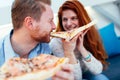 Couple sharing pizza and eating Royalty Free Stock Photo