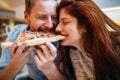 Couple sharing pizza and eating Royalty Free Stock Photo