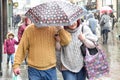 Couple shelter under umbrella In Heavy Rain in the ,UK. Royalty Free Stock Photo
