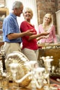 Couple shopping in antique shop Royalty Free Stock Photo