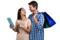 Couple with shopping bags using digital tablet Royalty Free Stock Photo