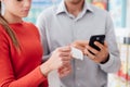 Couple shopping and checking a receipt Royalty Free Stock Photo