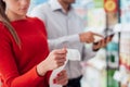 Couple shopping and checking a receipt Royalty Free Stock Photo