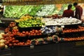 Couple shopping in the fruit and vegetable section of a store