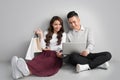 Couple shopping online. Happy couple looking together sitting fl Royalty Free Stock Photo