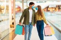 Couple Shopping Walking Holding Hands In Mall, Wearing Face Masks Royalty Free Stock Photo