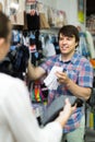 Couple shops at store buying socks Royalty Free Stock Photo