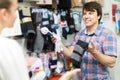 Couple shops at store buying socks Royalty Free Stock Photo