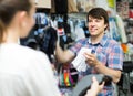 Couple shops at store buying socks Royalty Free Stock Photo