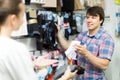 Couple shops at store buying socks Royalty Free Stock Photo