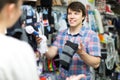 Couple shops at store buying socks Royalty Free Stock Photo