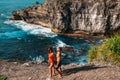 Couple on the shore of Paradise island. Honeymoon trip. Lovers on the beach. Wedding travel. Couple on vacation.