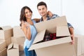 Couple showing keys to new home hugging looking at camera Royalty Free Stock Photo