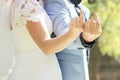 Couple showing middle fingers with wedding rings