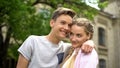 Couple of shy happy teenagers embracing, first relationship, studentship Royalty Free Stock Photo